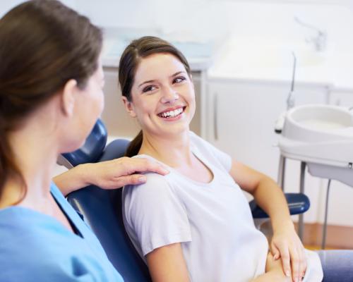 Dentist reassuring patient